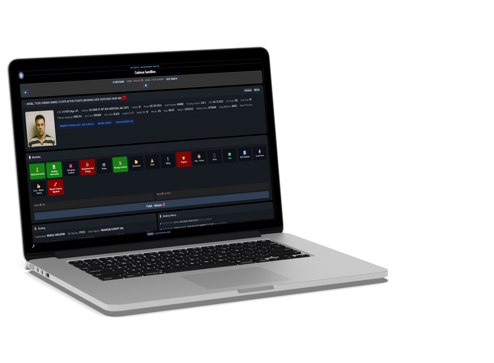 Silver laptop displaying a dark video editing interface on screen