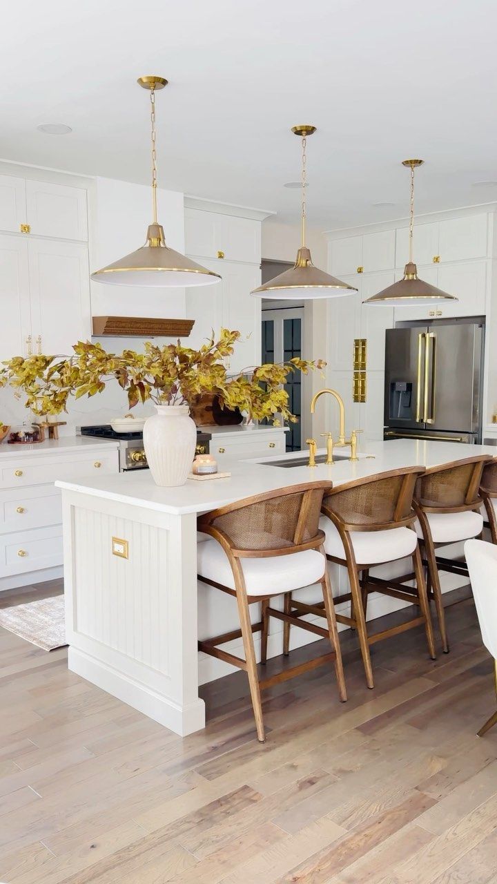 A kitchen with a large island and stools