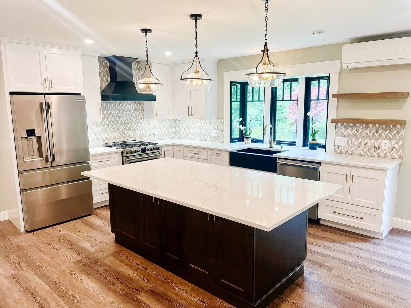 There is a large island in the middle of the kitchen.