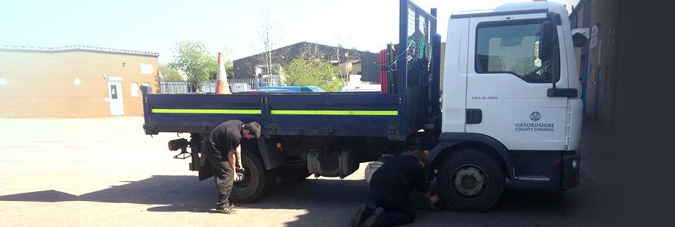A flatbed lorry having a new tyre fitted