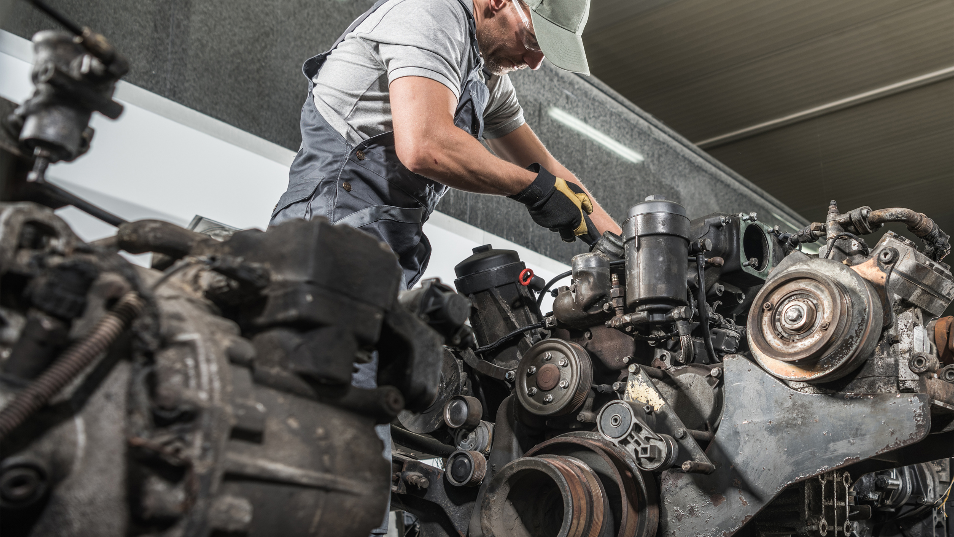 man repairing an engine