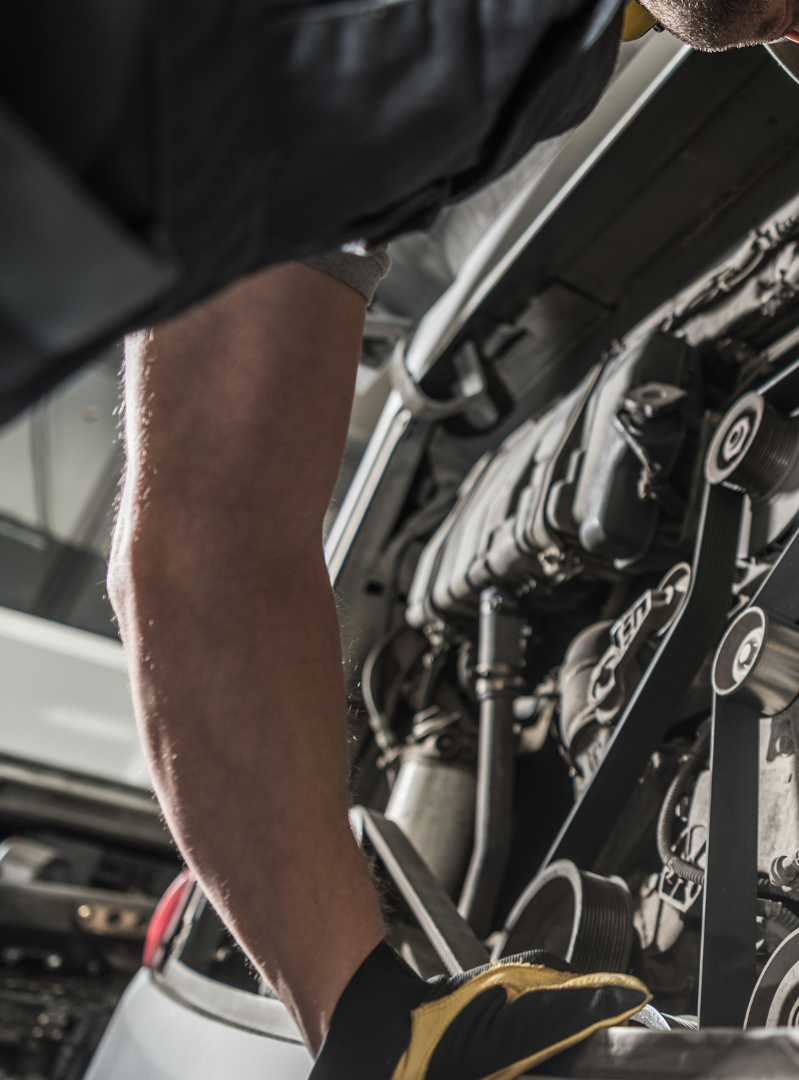 man repairing engine