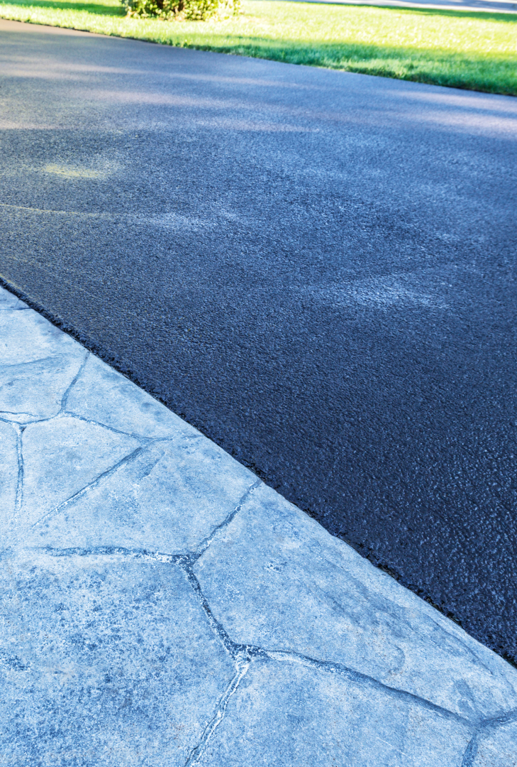 A close up of a sidewalk next to a road.