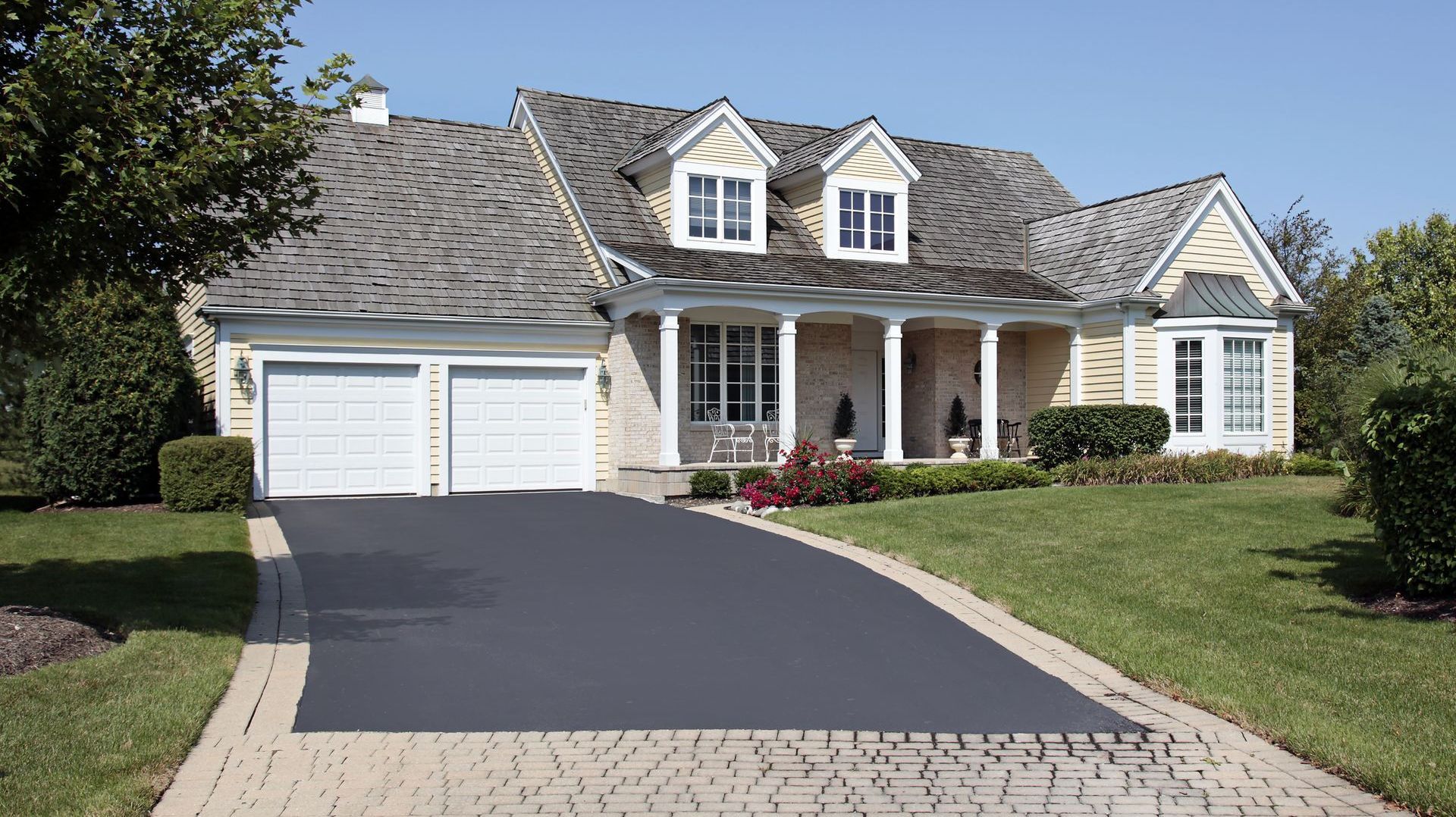 A large house with a driveway leading to it