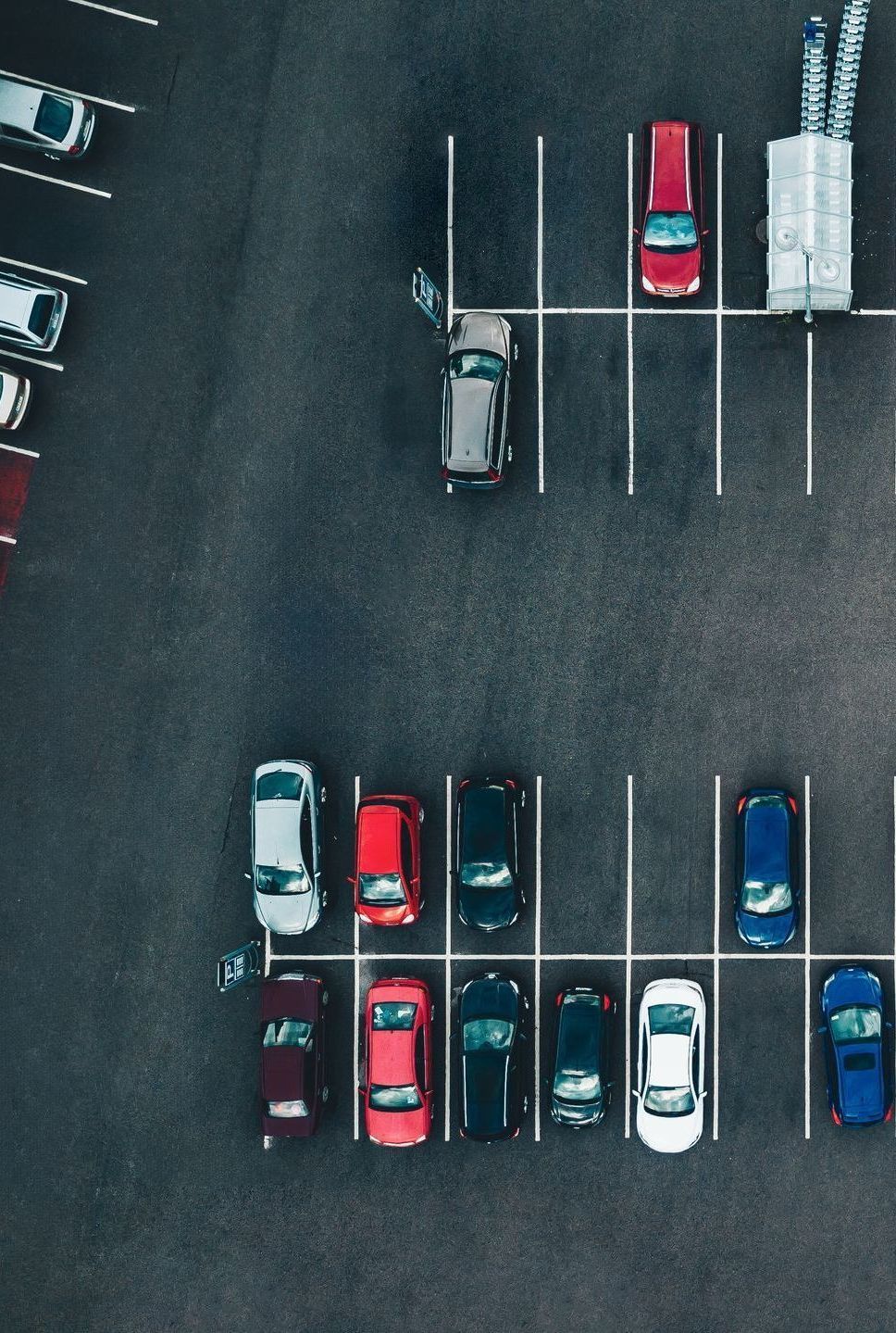 An aerial view of cars parked in a parking lot