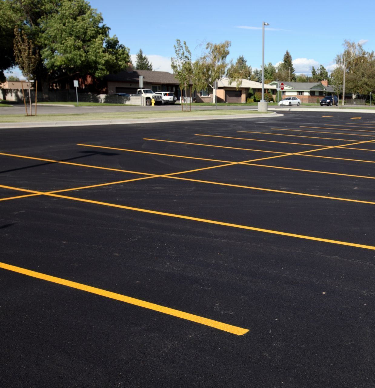 A parking lot with a yellow line in the middle