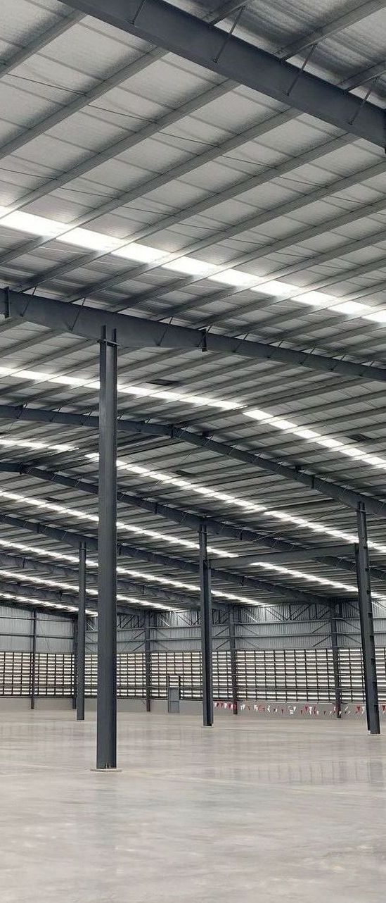 A large warehouse with a concrete floor