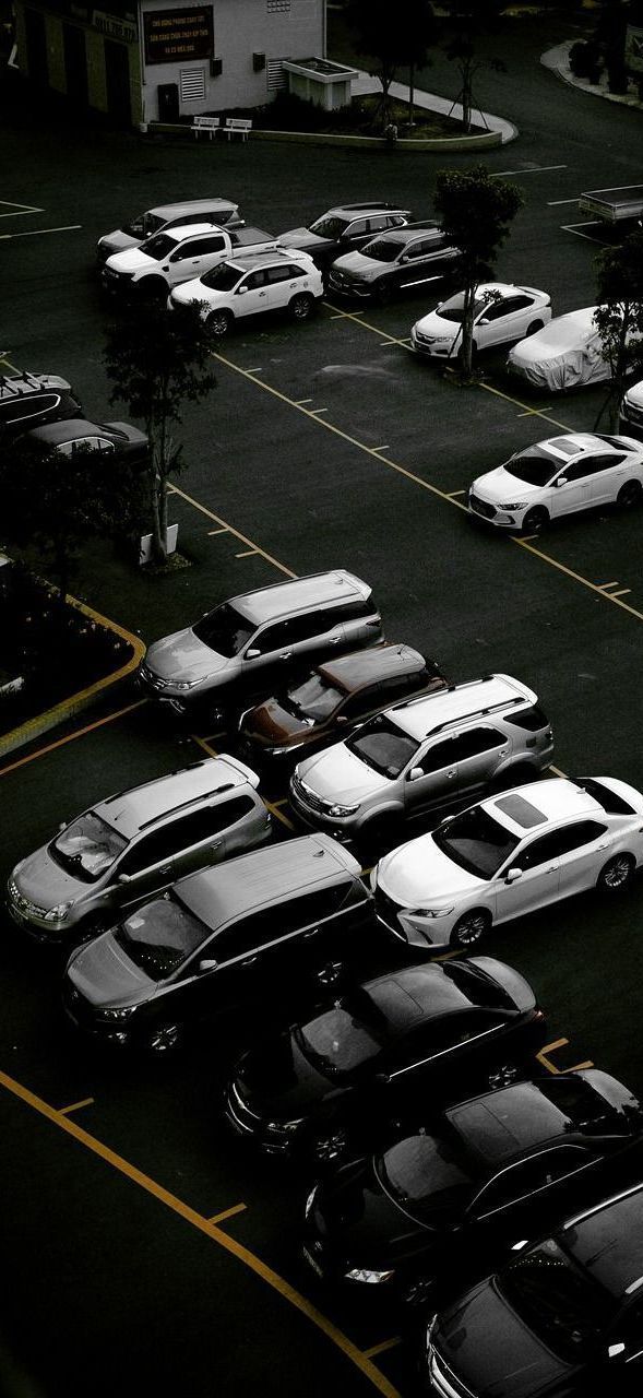 A lot of cars are parked in a parking lot