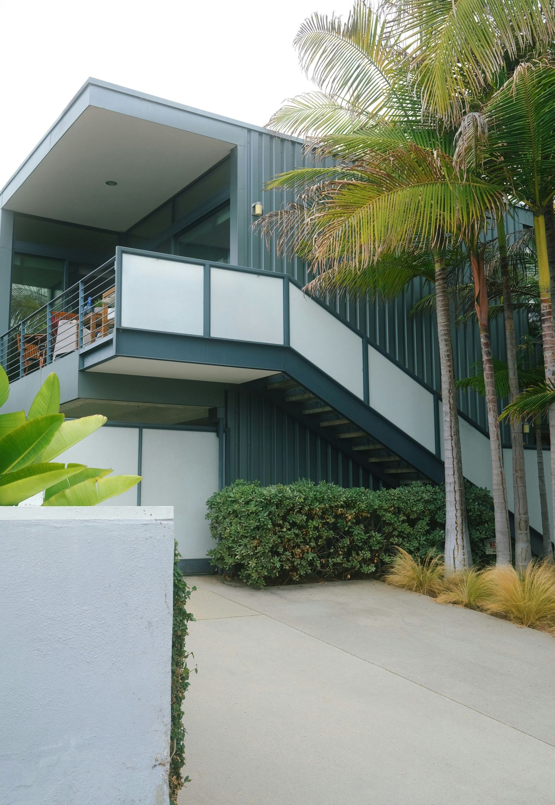 A building with stairs leading up to the second floor