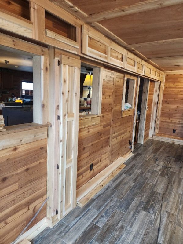 A room with wooden walls and a tiled floor.