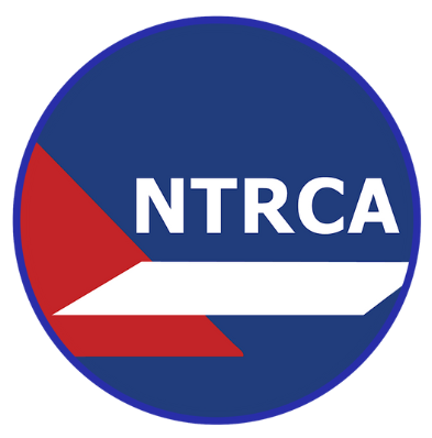 Logo of NTRCA, a white bar and red shape on a blue background, with white text: NTRCA.
