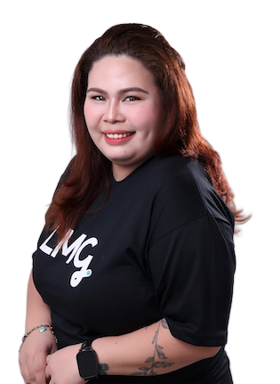 Smiling person in a black shirt with white lettering, posing against a light gray background