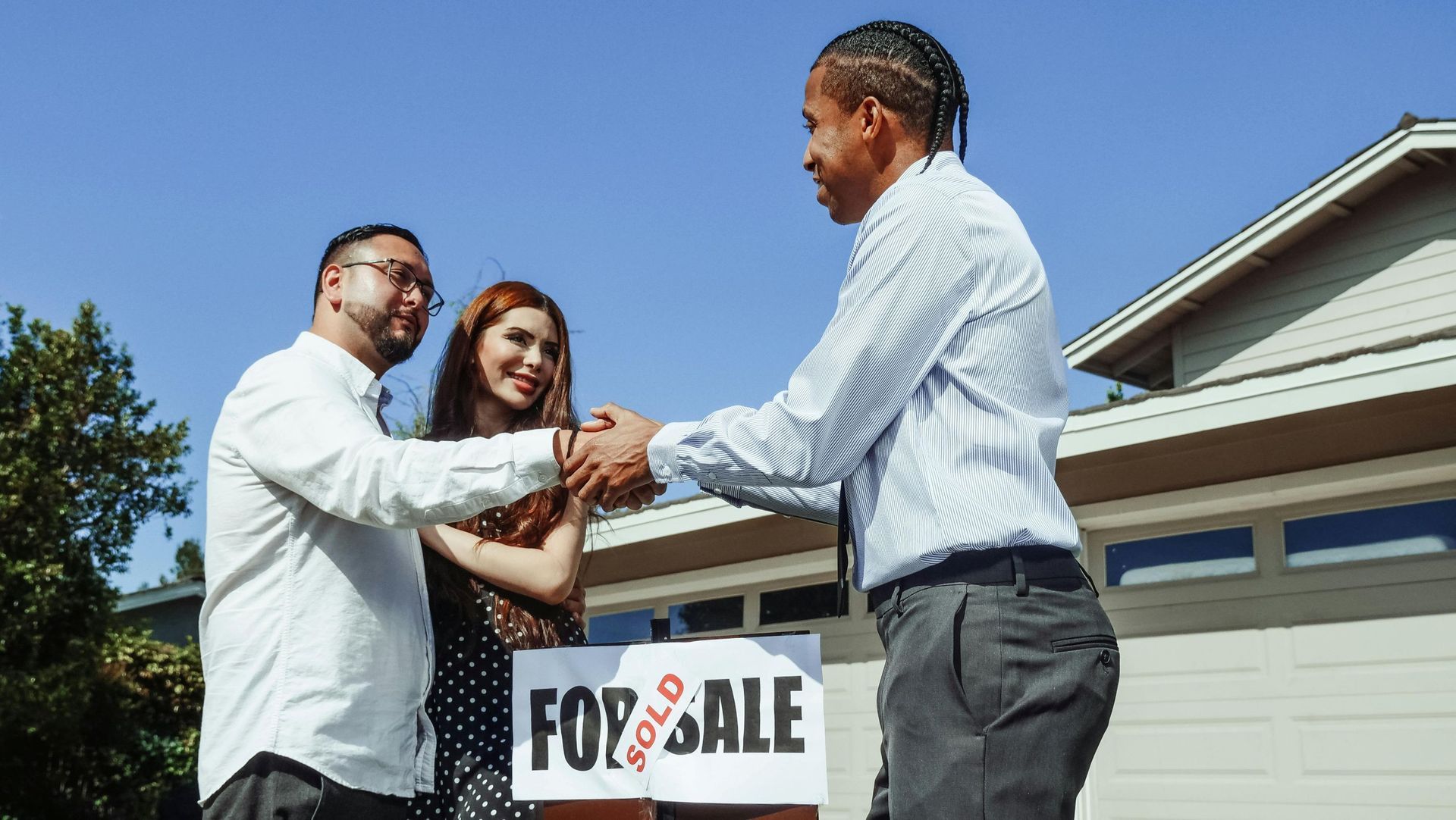 couple with real estate agent: Brisbane brokers help homebuyers with pre-appro