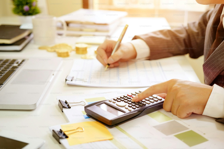 A broker calculating split home loans application. 