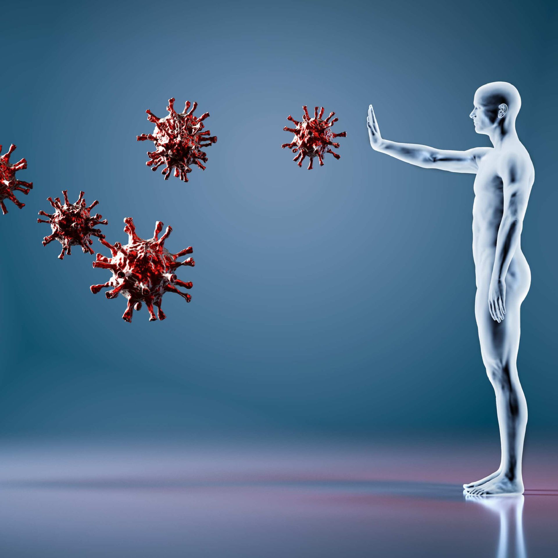 A man is standing in front of a row of red viruses.