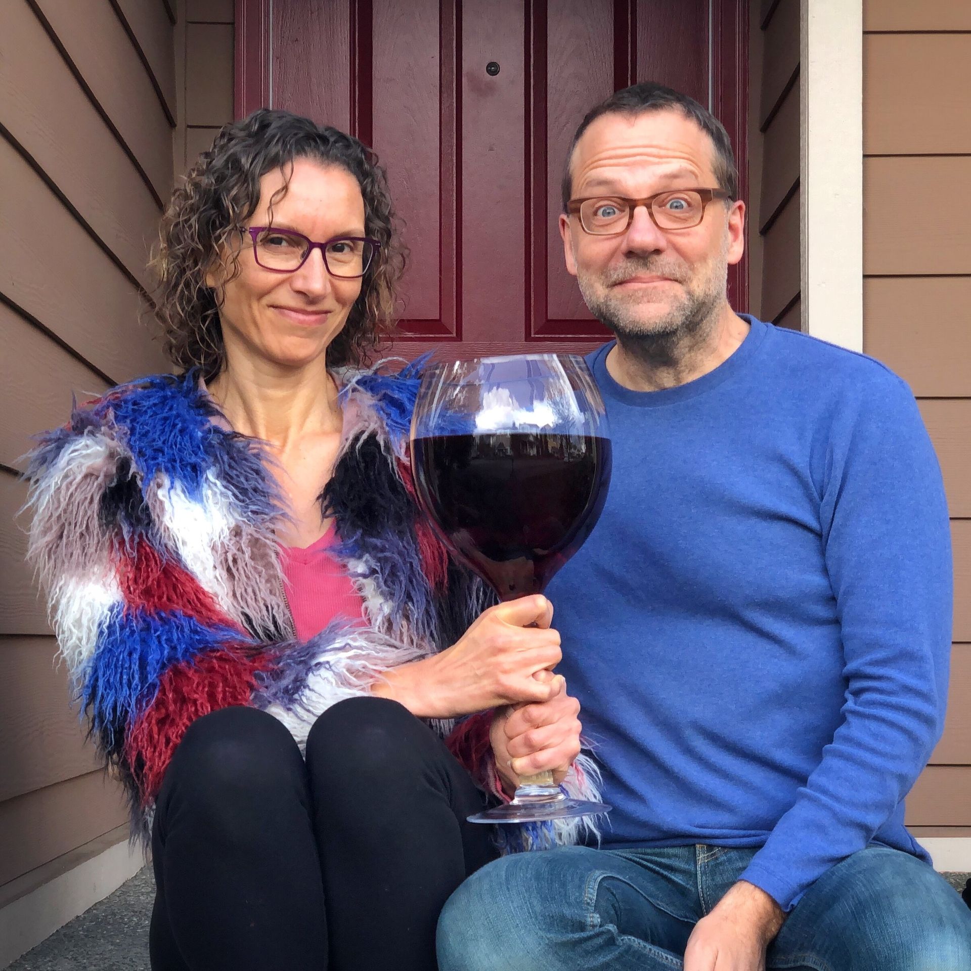 couple with enormous wine glass