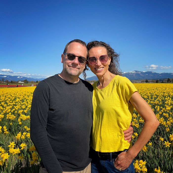 couple in field of daffodils 