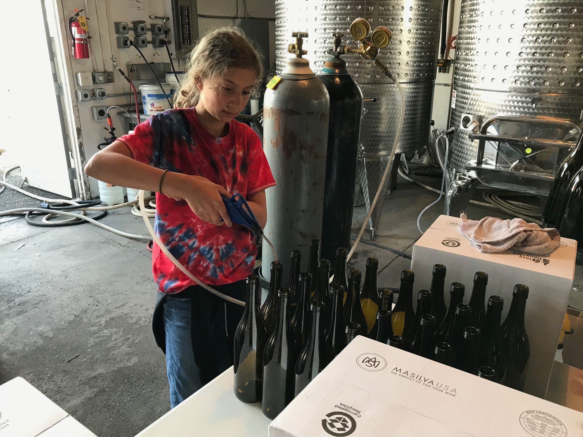 girl bottling wine