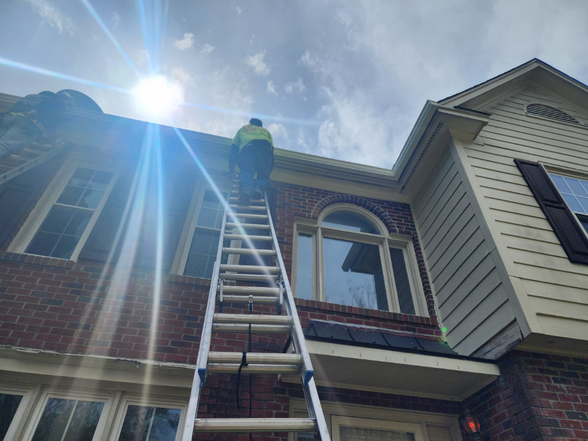 Professional gutter installer doing gutter preparation