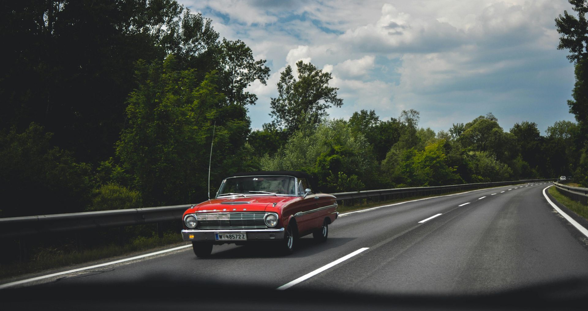 A toyota supra is parked on the side of the road.