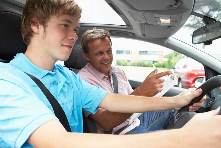 boy, teen having driving lesson