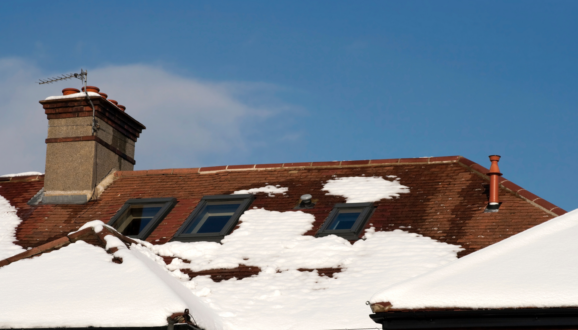 Uneven or premature snowmelt on a roof can indicate underlying insulation issues.