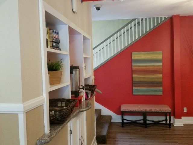 Hallway with red wall at 619 Living