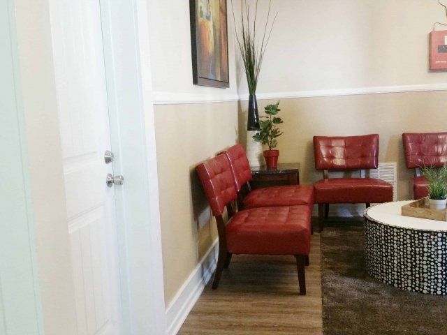 2nd image of common area in 619 Living unit with red chairs