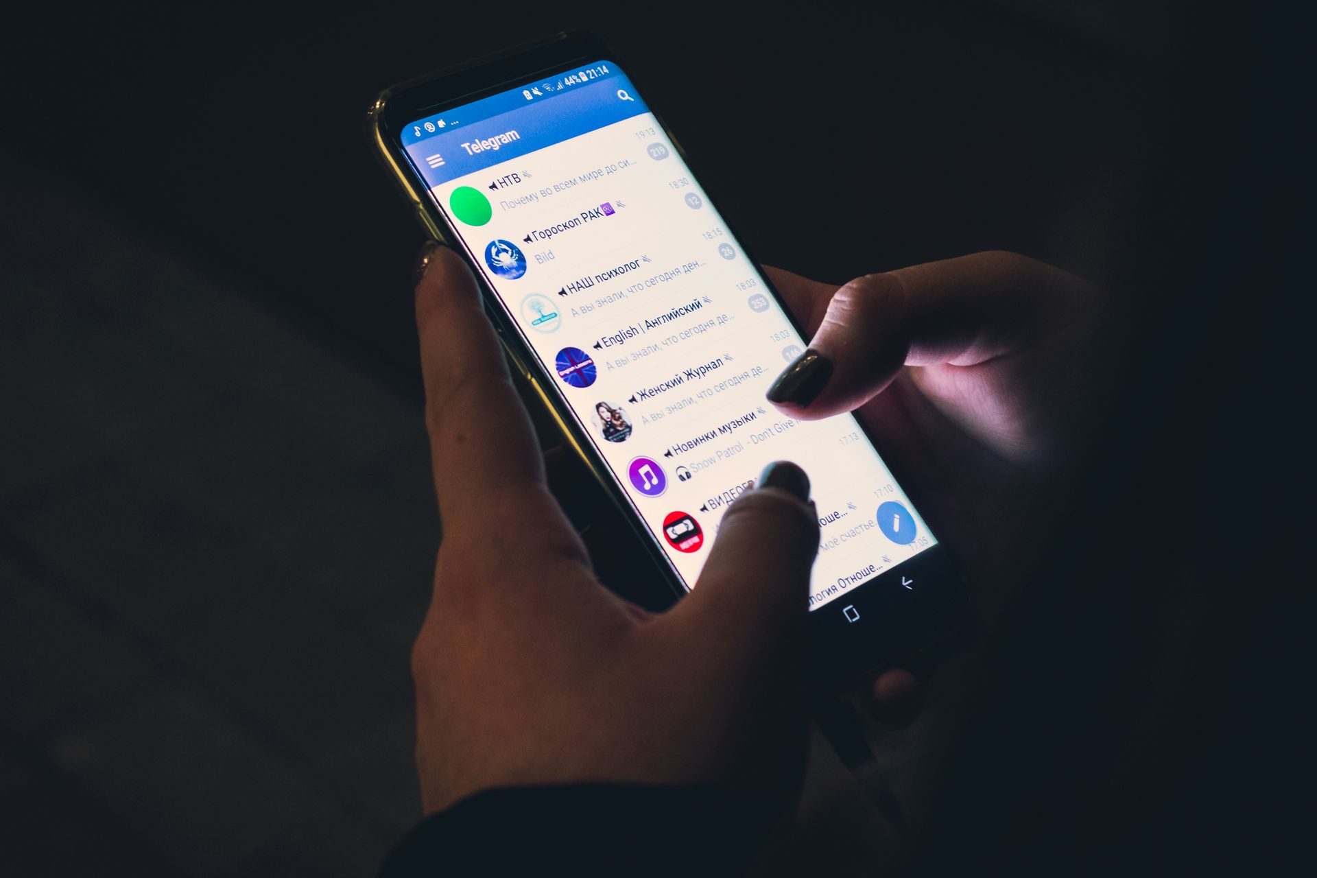 A person is holding a cell phone in their hand.