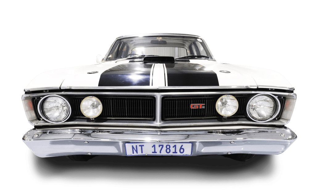 The front of a black and white muscle car with a license plate that says nt 17818.