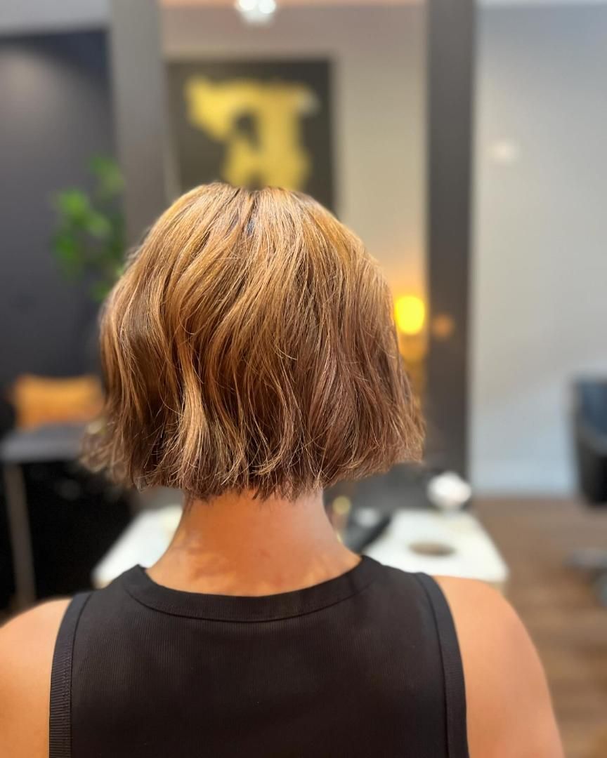 The Back of a Woman 's Head With Short Hair and a Black Tank Top — Energy Hair Co in Noosa Heads, QLD