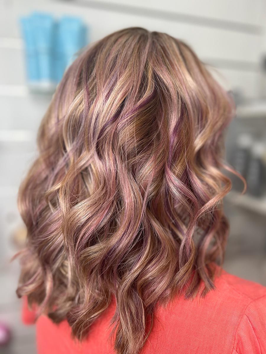 A Close Up of a Woman's Hair With a Red Shirt on — Energy Hair Co in Noosa Heads QLD