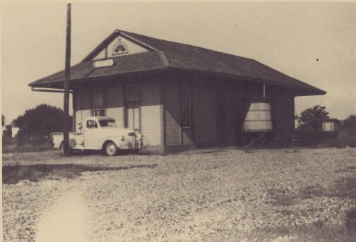 Vintage 1920s farm house photograph displayed at the museum