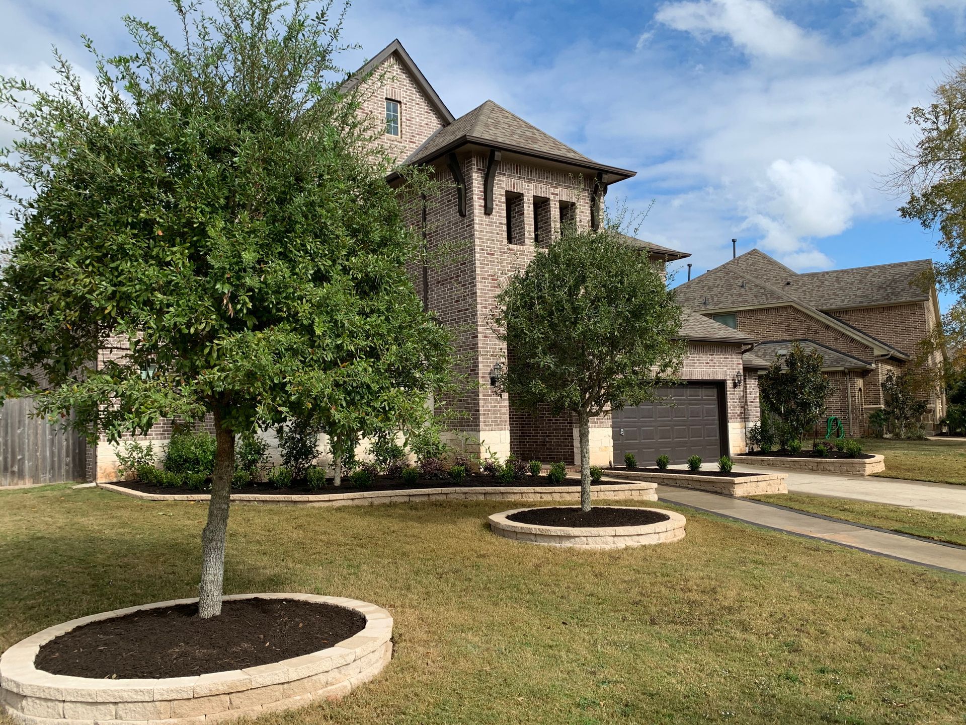 A large house with a lot of trees in front of it