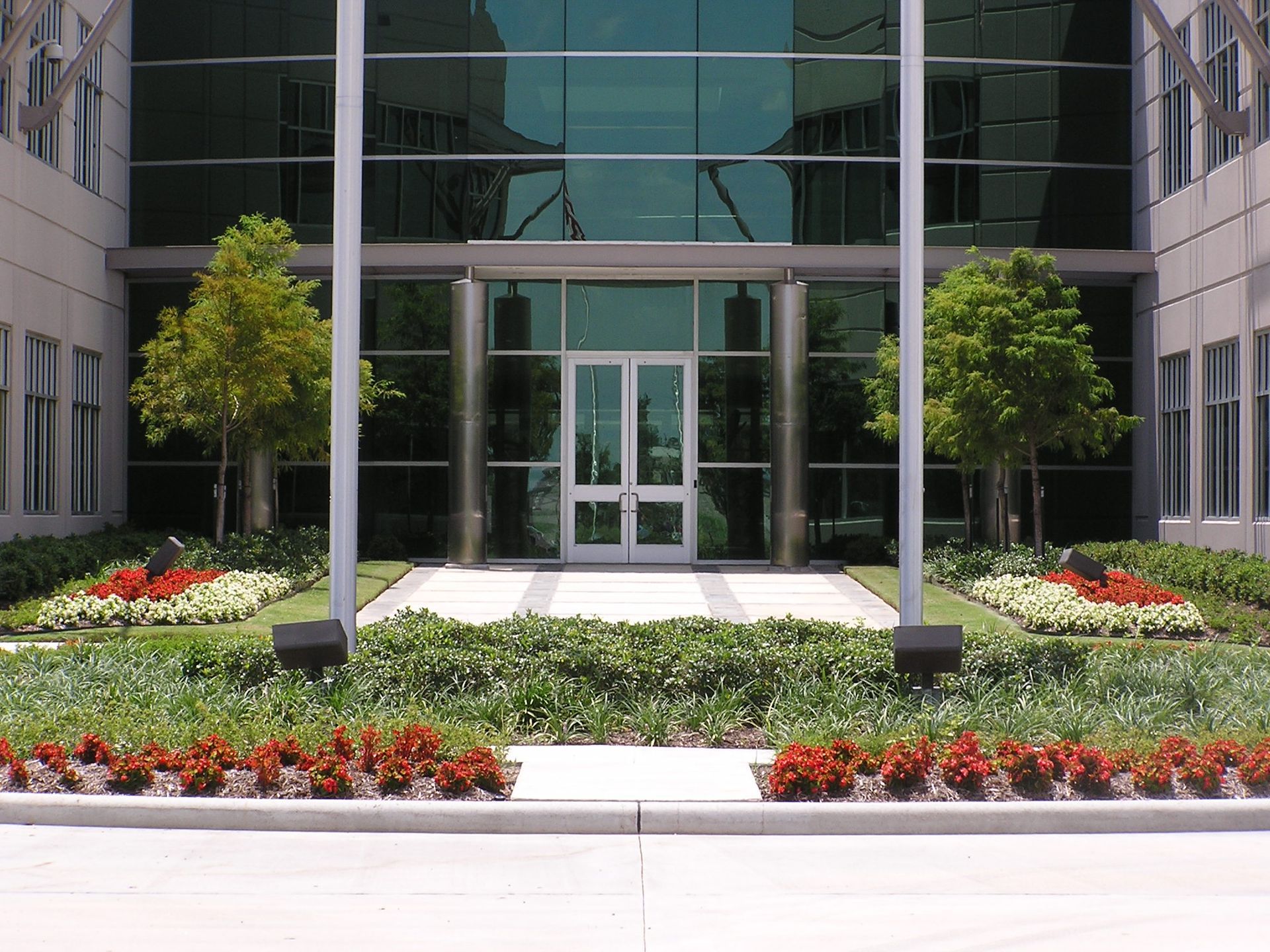A large glass building with a white door
