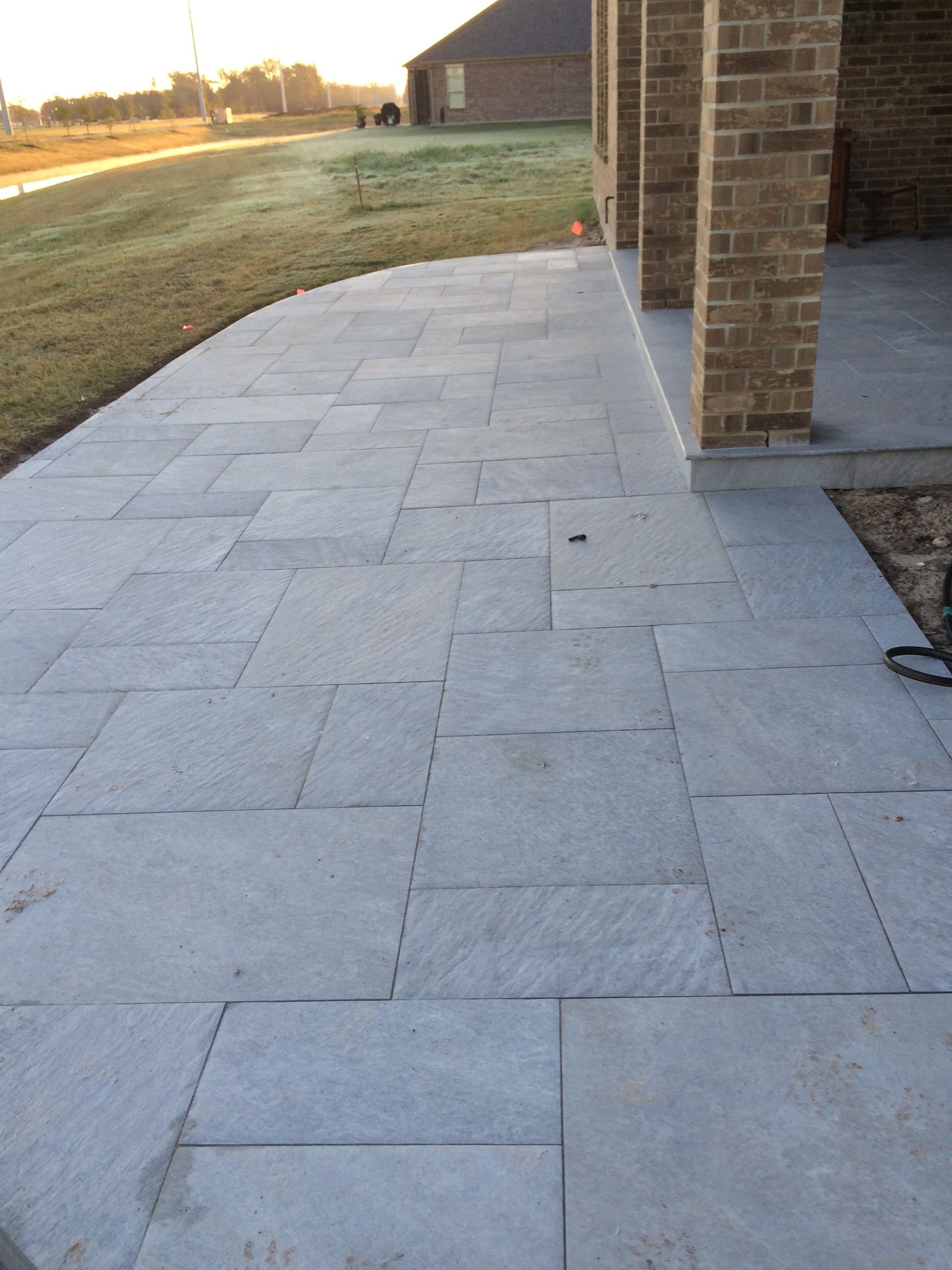 A brick building with a patio in front of it