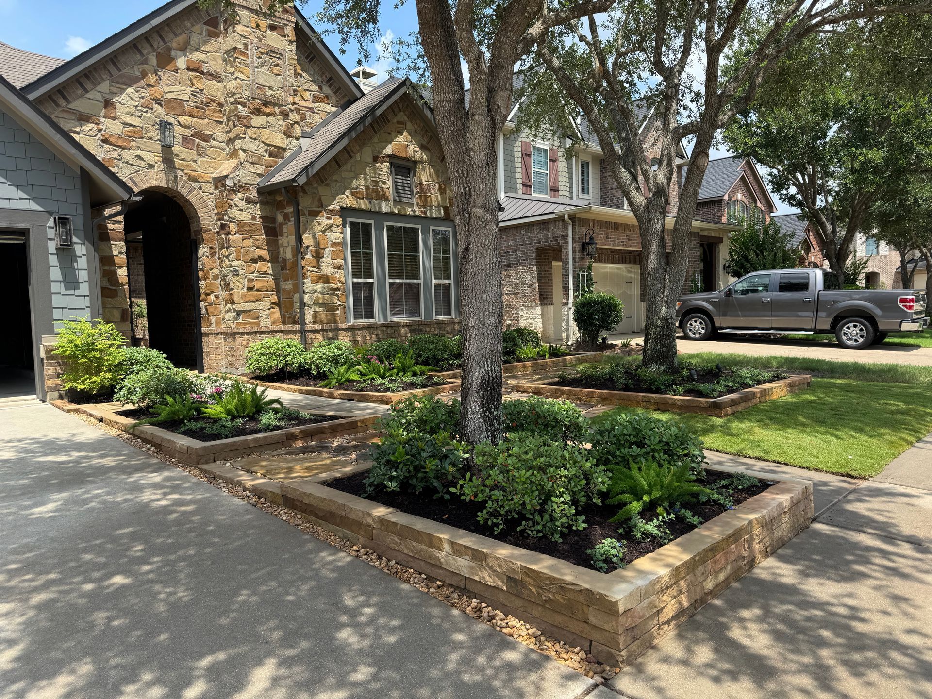 A house with a truck parked in front of it.
