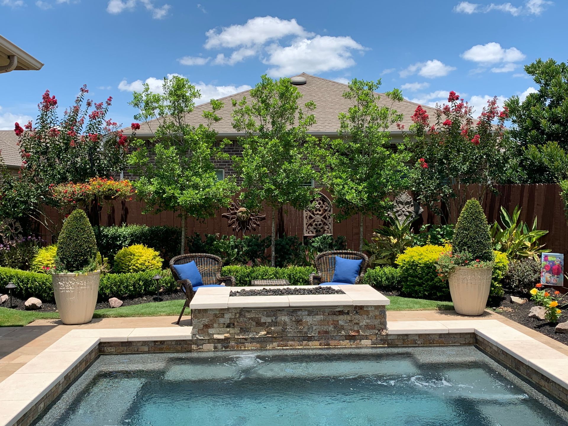 There is a fire pit in the middle of the pool.