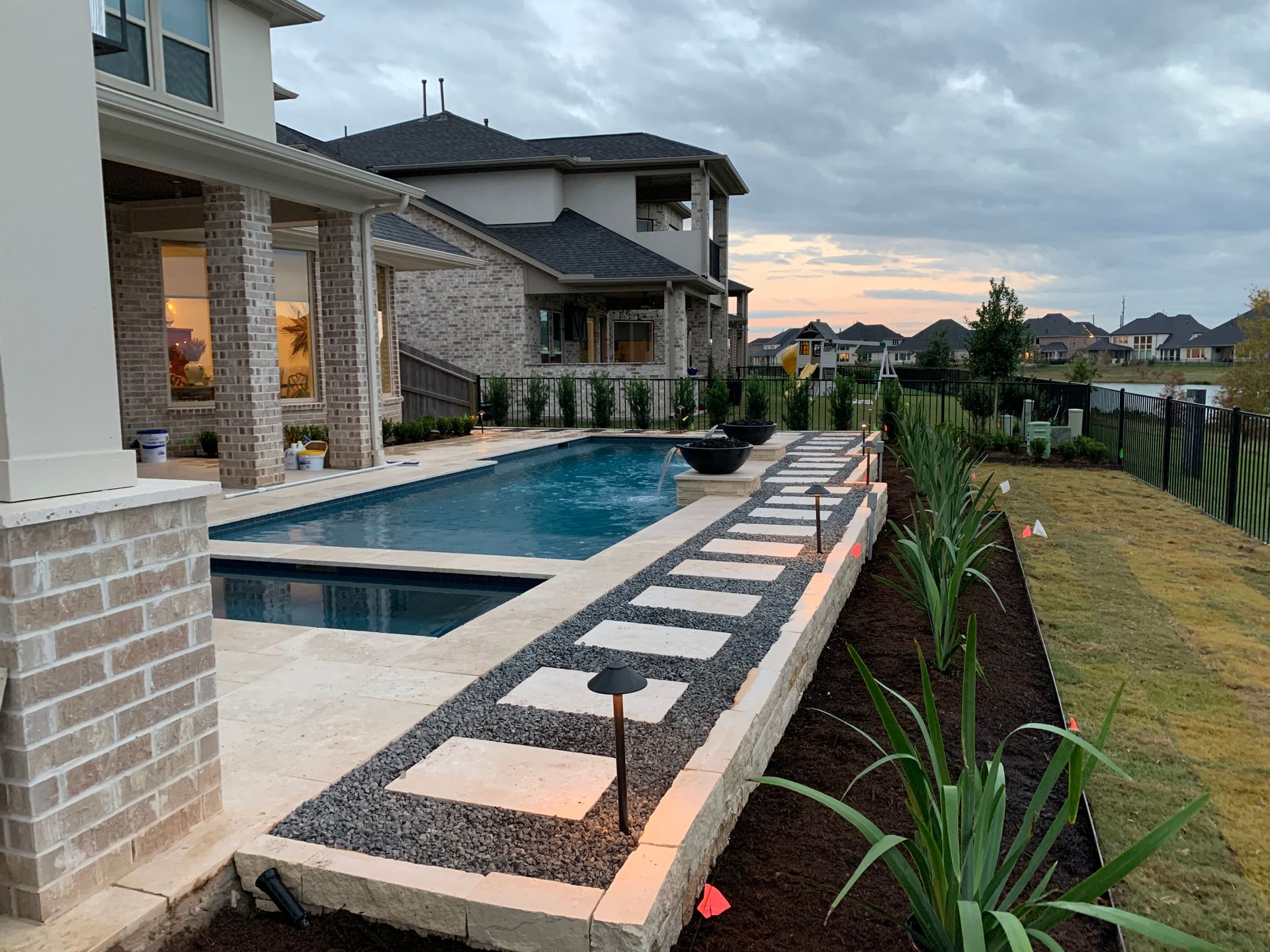 A large house with a large swimming pool in the backyard.