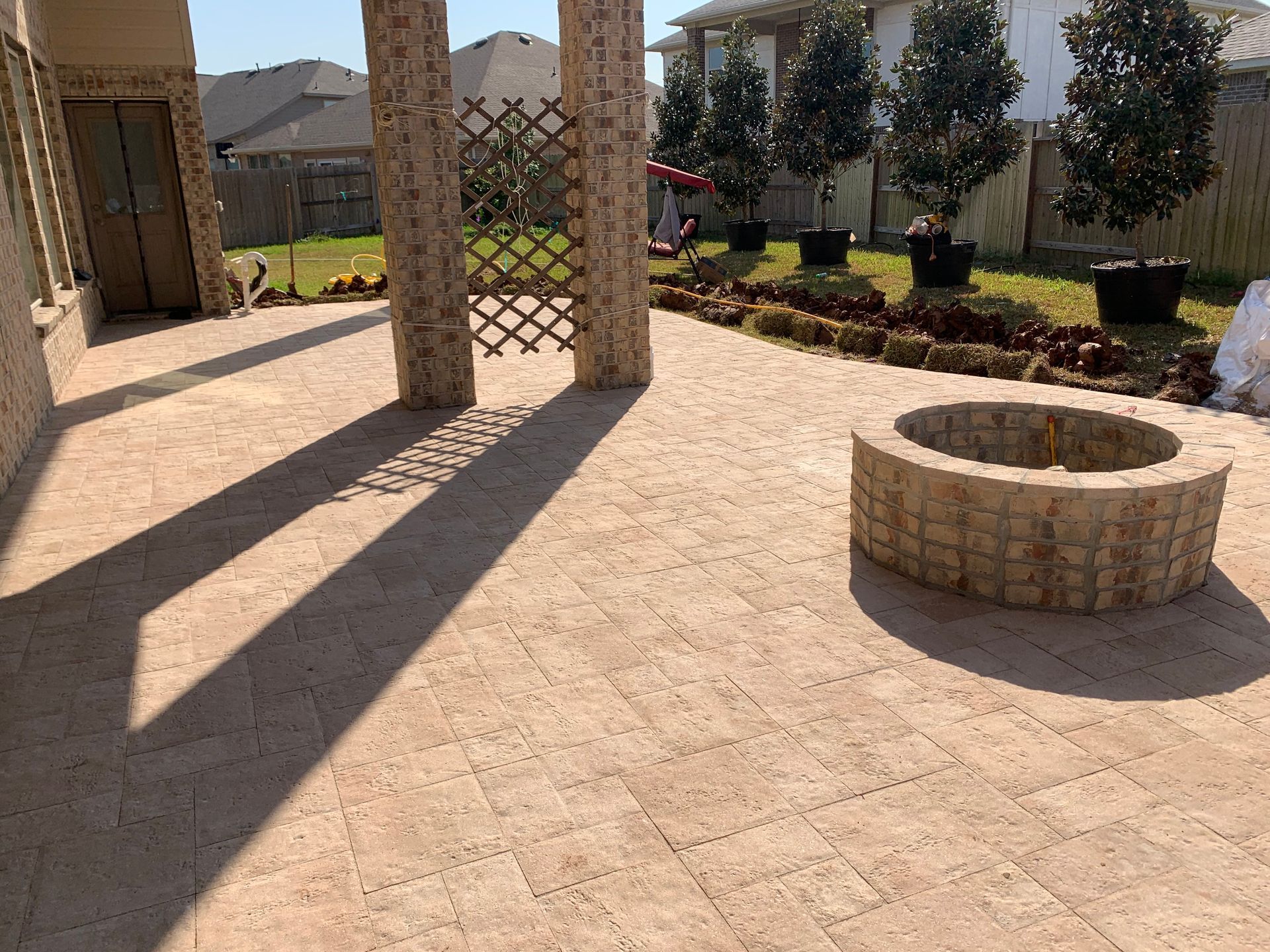 There is a fire pit in the middle of the patio.