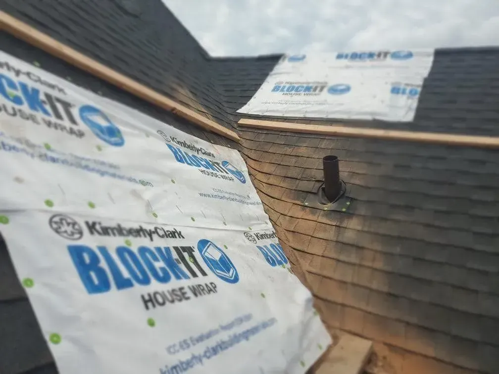 A roof is being covered with blockit house wrap