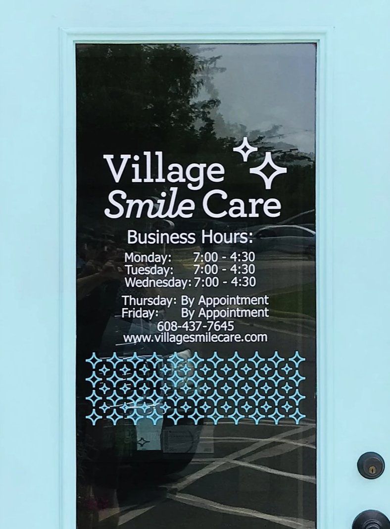 village care dental door sign