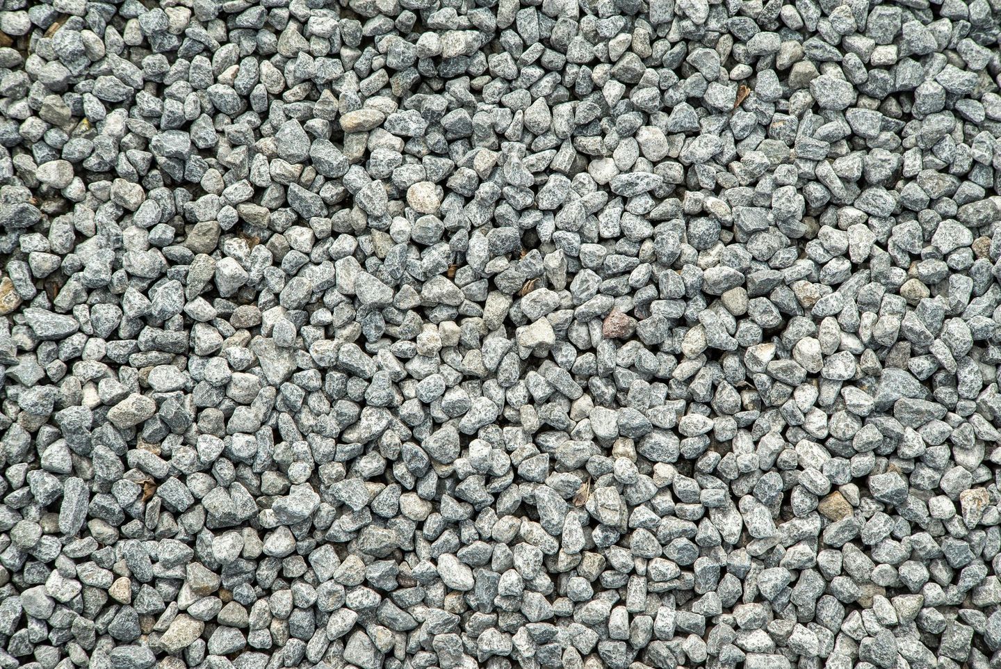 A pile of gravel is sitting on the ground.