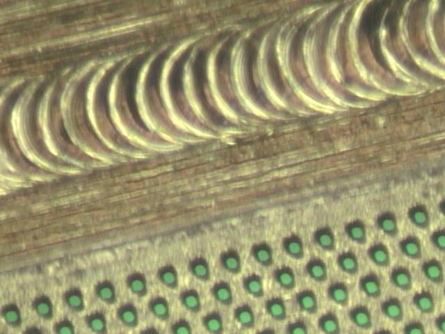 A close up of a metal coil.