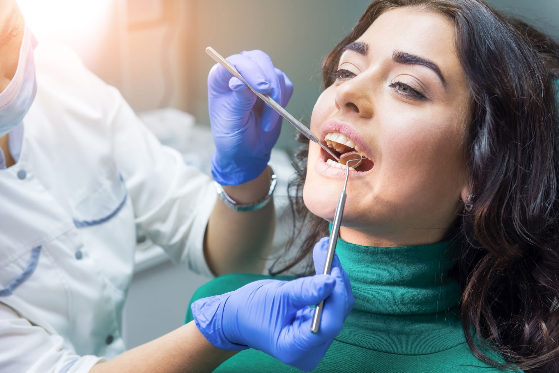 Close-up of the hands of a dentist at work.