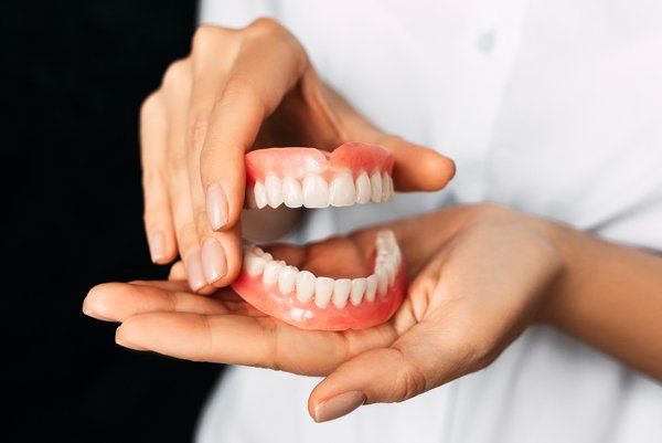Dentist Holding Dentures — Baker, LA — Rabel Family Dentistry