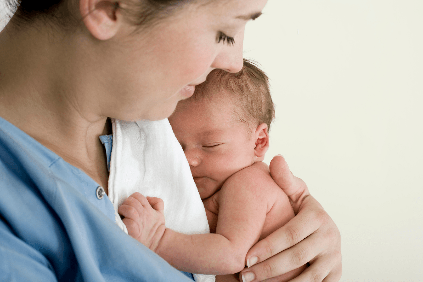 Baby sleeping in mother's arm
