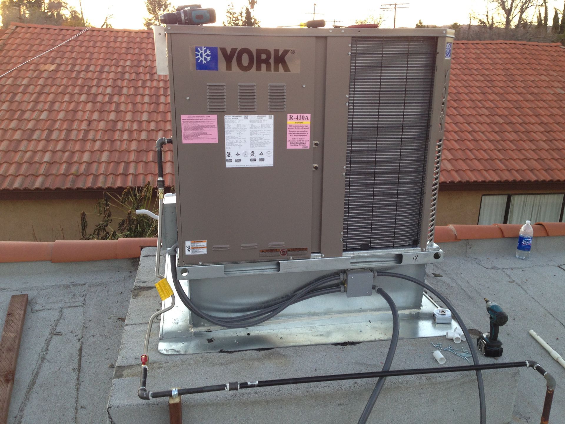 A york air conditioner is sitting on top of a roof