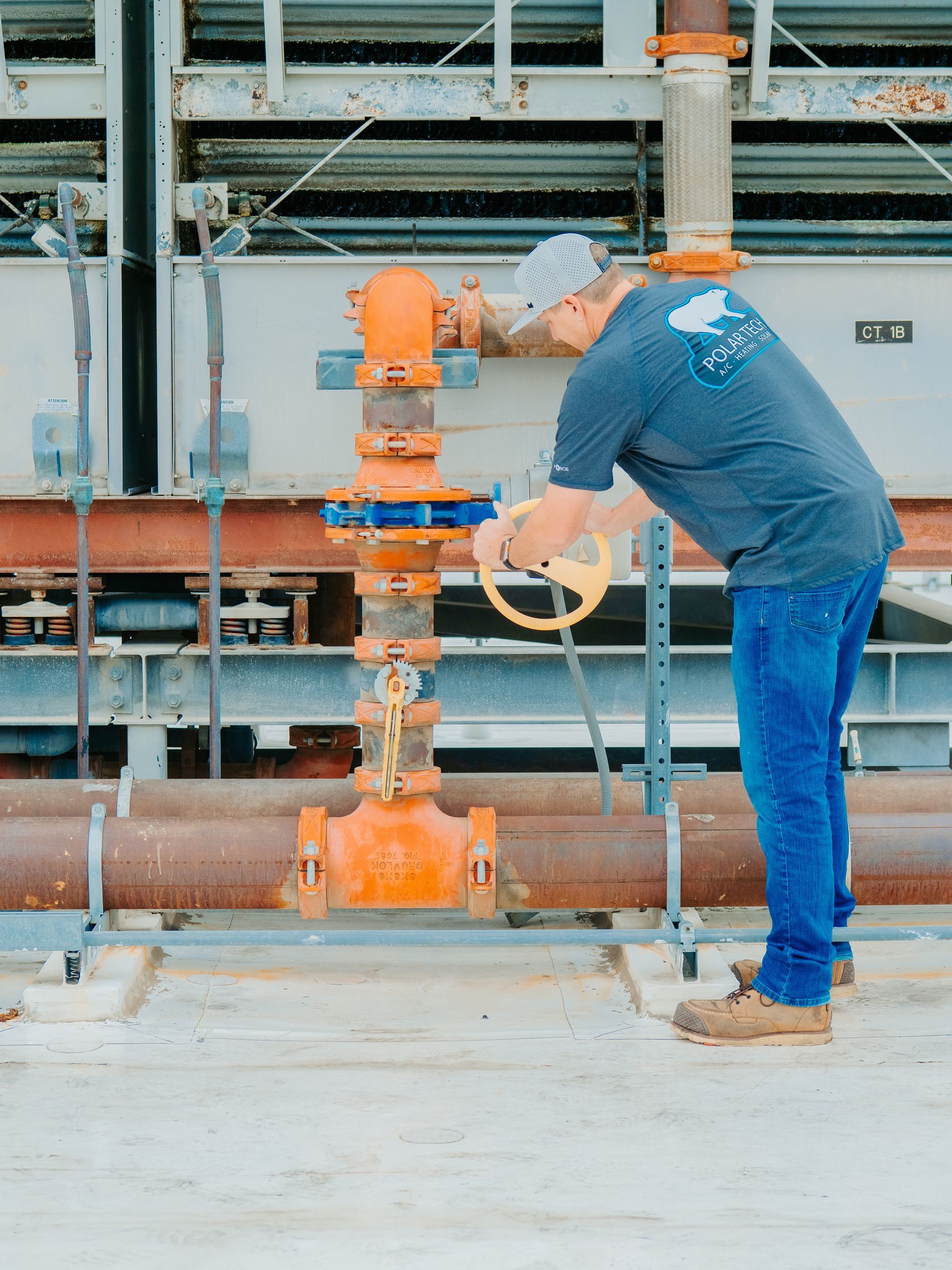 A family is sitting on a couch laughing together.