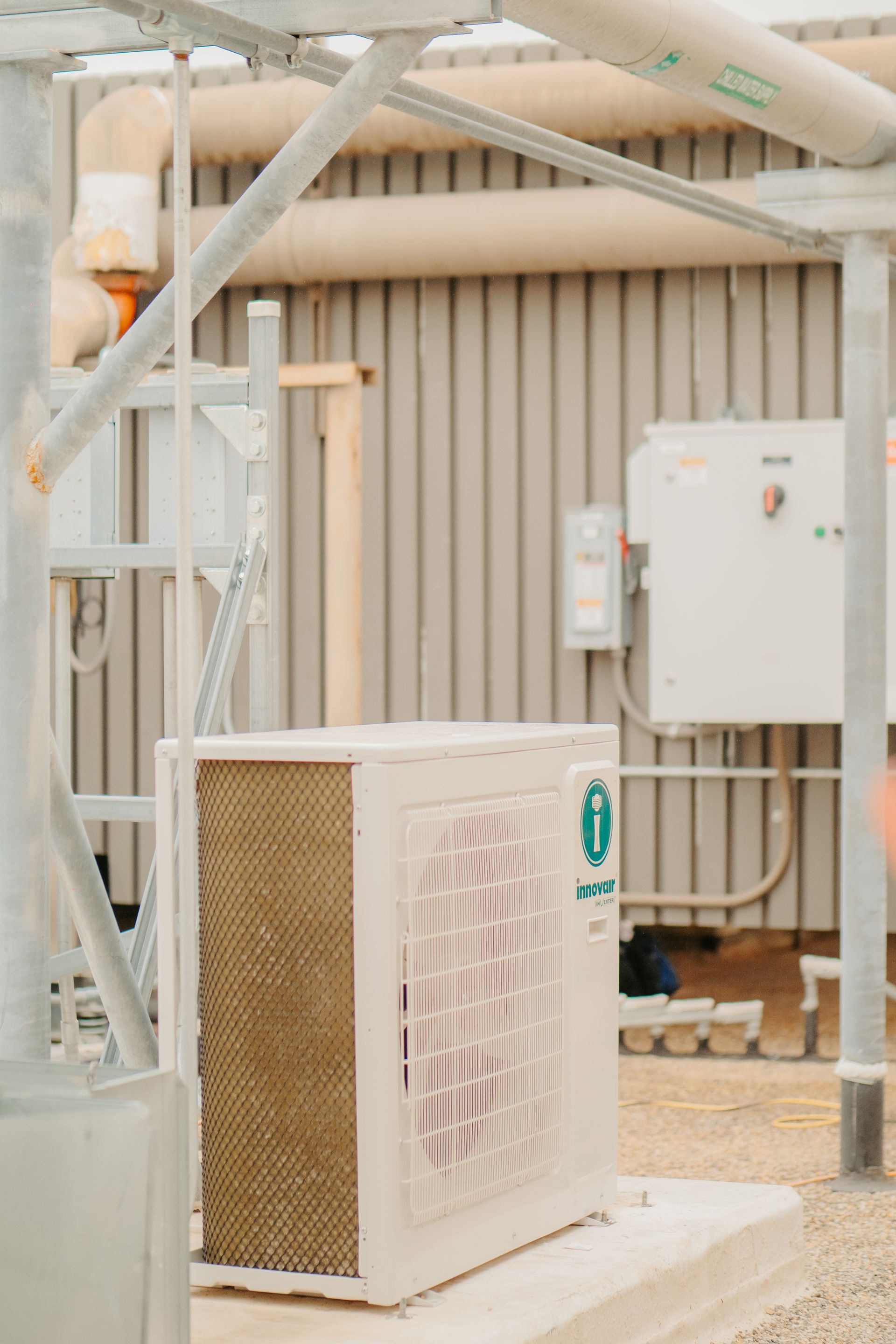 A family is sitting on the steps of their house.